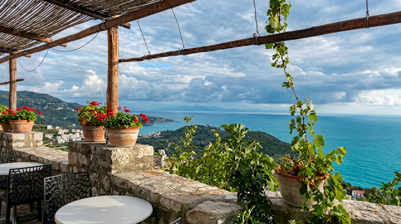 Cappuccino and trileçe on a terrace overlooking the turquoise Ionian Sea at Café Butterfly in Himarë Castle